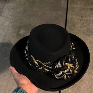 Elegant Black Hat with Gold and Silver Accents